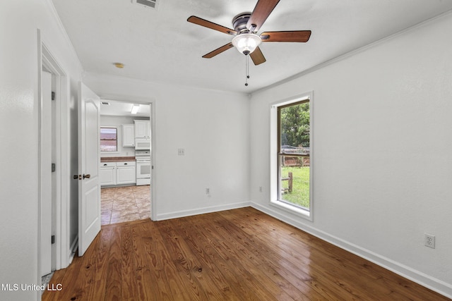 1914 Twin Pine Dr, Pearl, MS 39208 - unfurnished room featuring a ceiling fan, dark wood-type flooring, baseboards, and ornamental molding