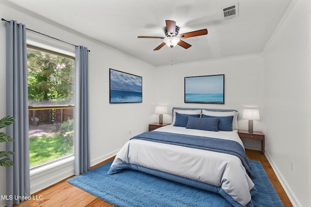 1914 Twin Pine Dr, Pearl, MS 39208 - bedroom featuring wood finished floors, baseboards, ornamental molding, and a ceiling fan
