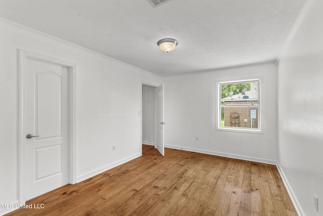 1914 Twin Pine Dr, Pearl, MS 39208 - unfurnished bedroom featuring light wood-style flooring, baseboards, and ornamental molding