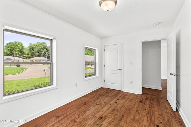 1914 Twin Pine Dr, Pearl, MS 39208 - unfurnished bedroom with wood finished floors, baseboards, and ornamental molding