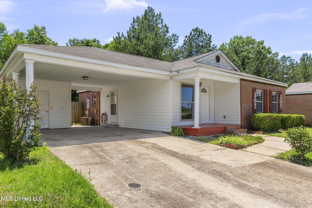 1914 Twin Pine Dr, Pearl, MS 39208 - view of front of home featuring covered porch, driveway, a carport, and brick siding
