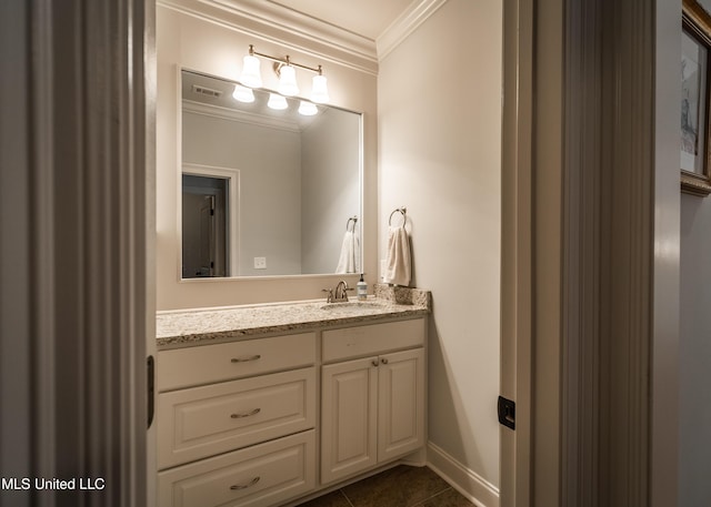 bathroom featuring tile patterned flooring, vanity, and ornamental molding