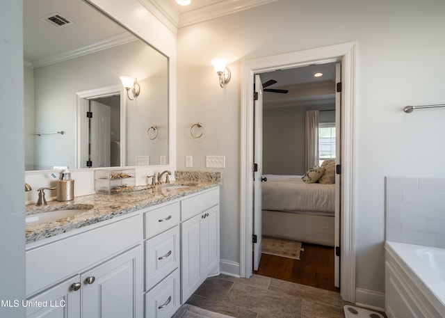 bathroom with vanity, ceiling fan, crown molding, tile patterned flooring, and a tub