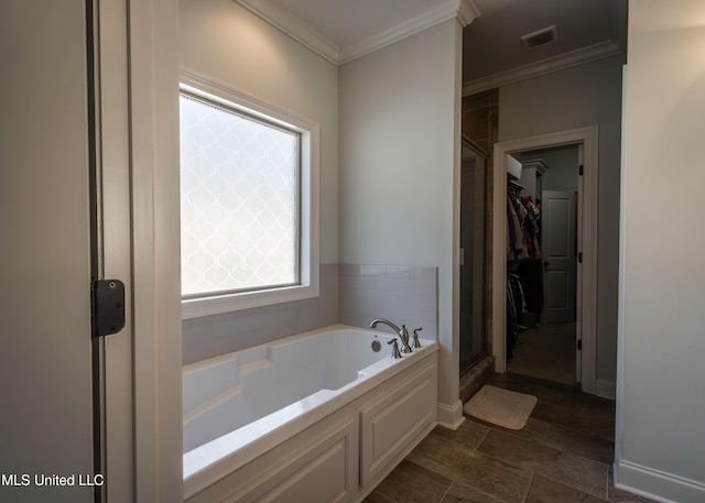 bathroom with shower with separate bathtub and ornamental molding