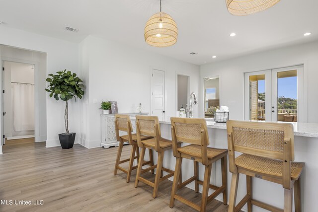 124 Arkansas Ave, Gulfport, MS 39507 - dining room with french doors, visible vents, baseboards, light wood-style floors, and recessed lighting