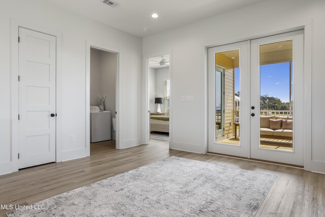 124 Arkansas Ave, Gulfport, MS 39507 - unfurnished bedroom with access to exterior, french doors, washer / clothes dryer, recessed lighting, and wood finished floors