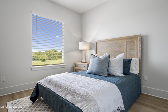 124 Arkansas Ave, Gulfport, MS 39507 - bedroom with baseboards and wood finished floors
