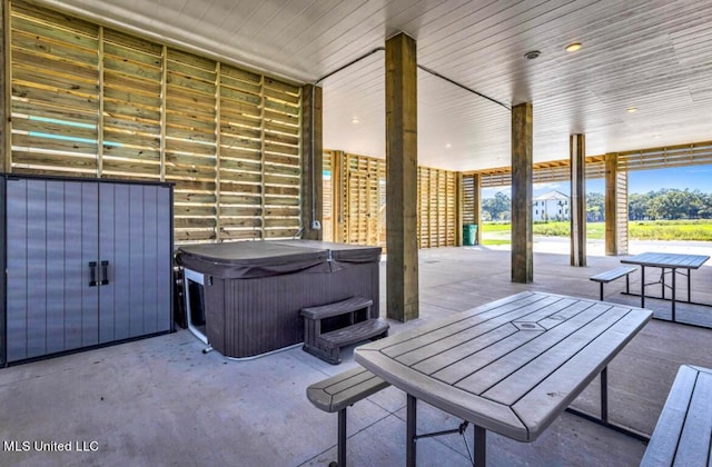 view of patio with a hot tub