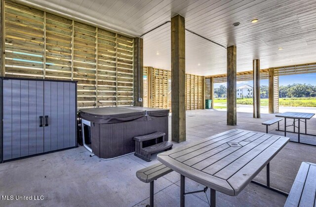 124 Arkansas Ave, Gulfport, MS 39507 - view of patio / terrace with outdoor dining area and a hot tub
