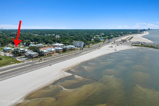 bird's eye view featuring a water view and a view of the beach