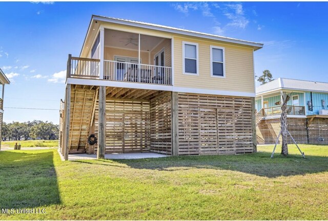 124 Arkansas Ave, Gulfport, MS 39507 - rear view of property featuring stairs, ceiling fan, and a yard