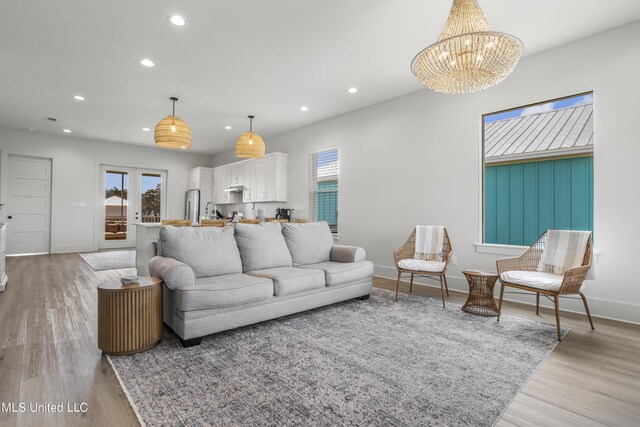124 Arkansas Ave, Gulfport, MS 39507 - living area with light wood-style floors, plenty of natural light, and recessed lighting