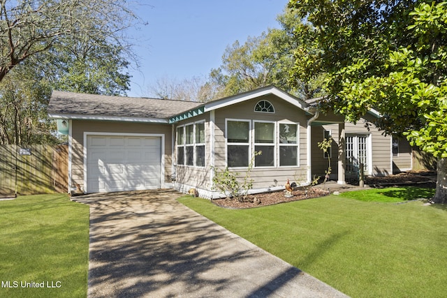 view of front of house with an attached garage, fence, concrete driveway, and a front yard