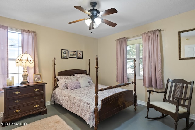 bedroom with multiple windows, baseboards, and a ceiling fan