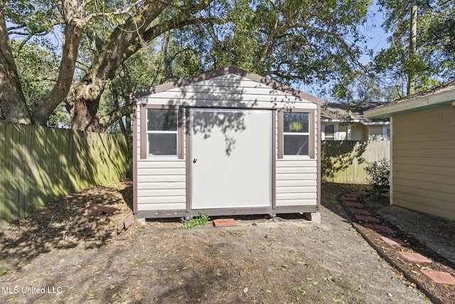 view of shed featuring a fenced backyard