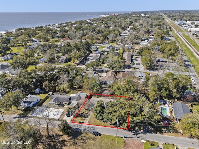 drone / aerial view featuring a residential view and a water view