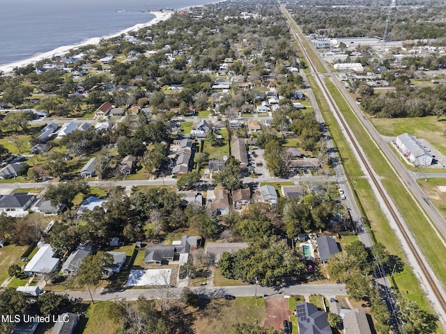 aerial view with a water view, a view of the beach, and a residential view