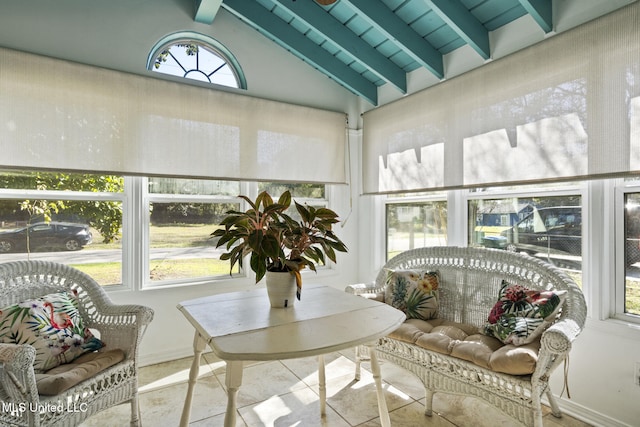 sunroom with lofted ceiling with beams