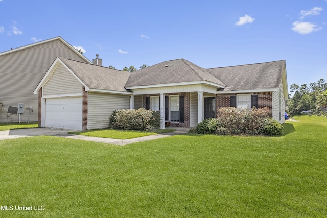 view of front of property featuring a front lawn, a garage, and covered porch