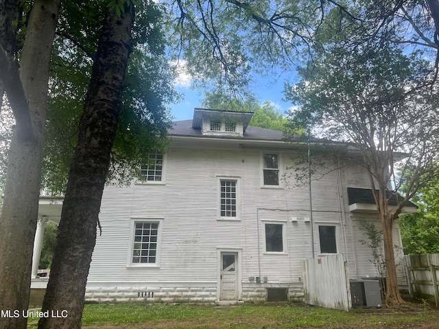 rear view of property with central air condition unit