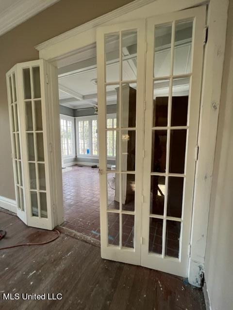 doorway with french doors, beamed ceiling, and ceiling fan