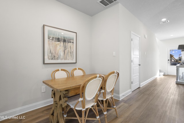 12278 Frazier Ln, Gulfport, MS 39503 - dining area with wood finished floors, baseboards, and recessed lighting