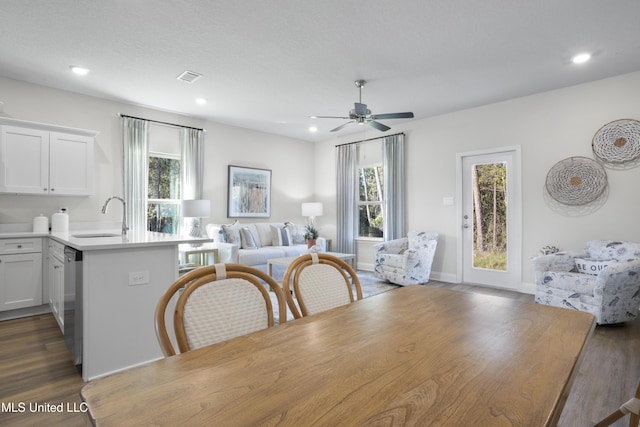 12278 Frazier Ln, Gulfport, MS 39503 - dining area featuring healthy amount of natural light, ceiling fan, dark wood-type flooring, and recessed lighting