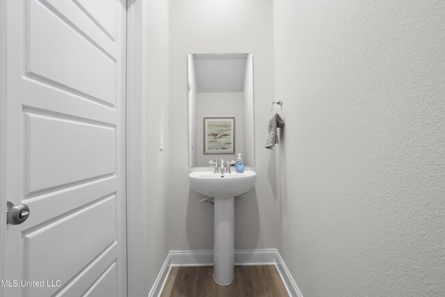 12278 Frazier Ln, Gulfport, MS 39503 - bathroom with baseboards and wood finished floors