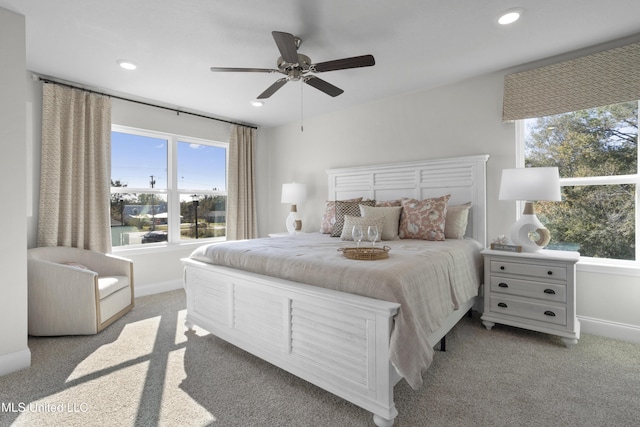 12278 Frazier Ln, Gulfport, MS 39503 - carpeted bedroom featuring multiple windows, recessed lighting, baseboards, and a ceiling fan