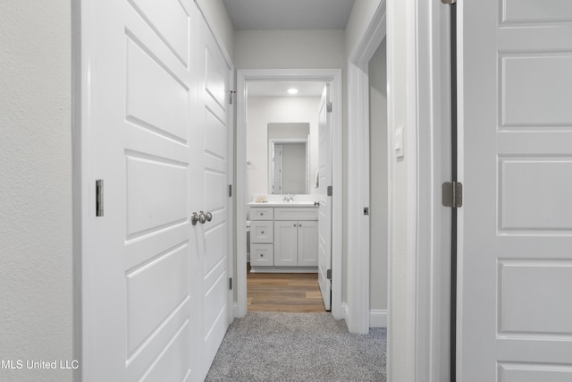 12278 Frazier Ln, Gulfport, MS 39503 - corridor featuring carpet floors, a sink, and baseboards