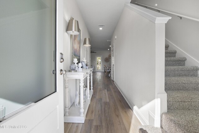 12278 Frazier Ln, Gulfport, MS 39503 - corridor featuring wood finished floors, stairs, and recessed lighting