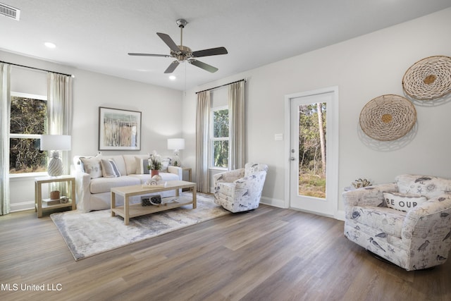 12278 Frazier Ln, Gulfport, MS 39503 - living area with wood finished floors, ceiling fan, baseboards, and recessed lighting