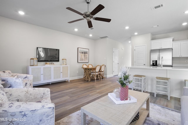 12278 Frazier Ln, Gulfport, MS 39503 - living area with ceiling fan, wood finished floors, recessed lighting, and baseboards