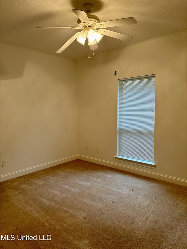 1405 Bay Ridge Dr, Gautier, MS 39553 - empty room with carpet flooring, ceiling fan, baseboards, and a textured ceiling