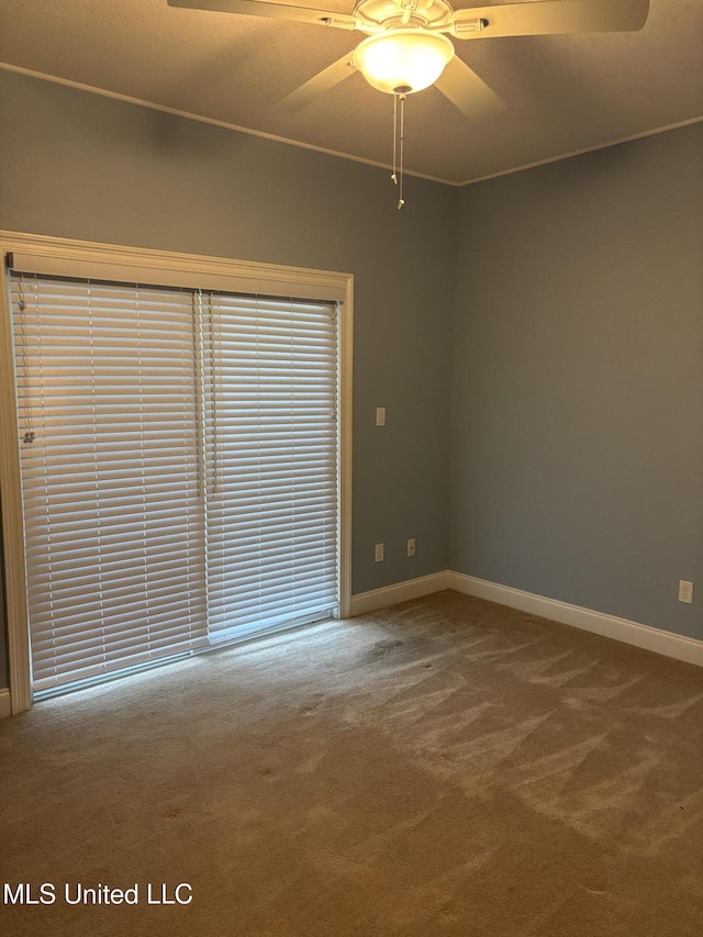1405 Bay Ridge Dr, Gautier, MS 39553 - carpeted empty room with baseboards and a ceiling fan