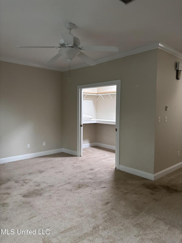 1405 Bay Ridge Dr, Gautier, MS 39553 - unfurnished room with crown molding, carpet flooring, a ceiling fan, and baseboards