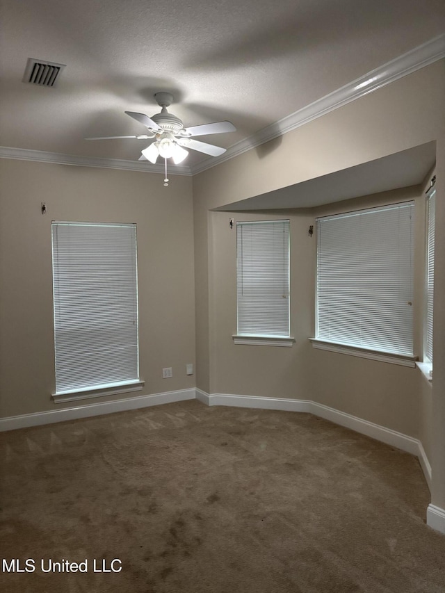 1405 Bay Ridge Dr, Gautier, MS 39553 - unfurnished room featuring ornamental molding, a ceiling fan, carpet flooring, and baseboards