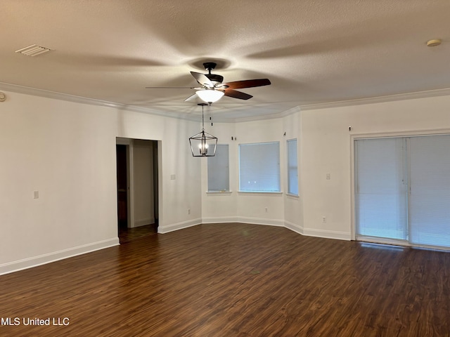 1405 Bay Ridge Dr, Gautier, MS 39553 - spare room featuring ceiling fan, dark wood-style floors, crown molding, baseboards, and a textured ceiling
