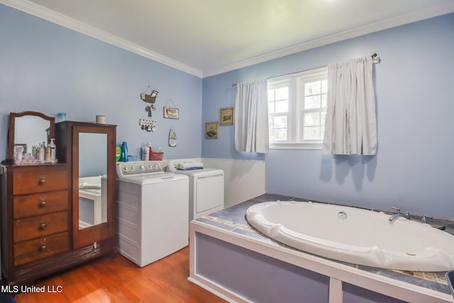221 S Third St, Wiggins, MS 39577 - full bath with washer and dryer, a bath, crown molding, and wood finished floors