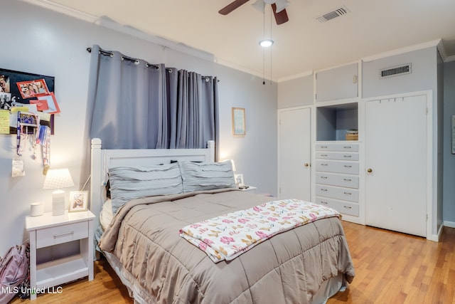 221 S Third St, Wiggins, MS 39577 - bedroom with crown molding, light wood-type flooring, ceiling fan, and vaulted ceiling
