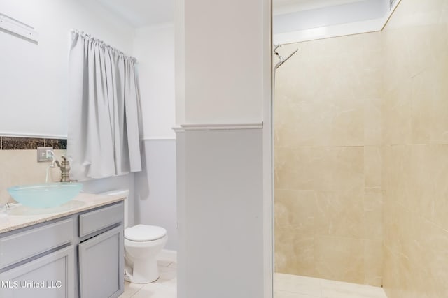 221 S Third St, Wiggins, MS 39577 - bathroom with a tile shower, vanity, and tile patterned flooring