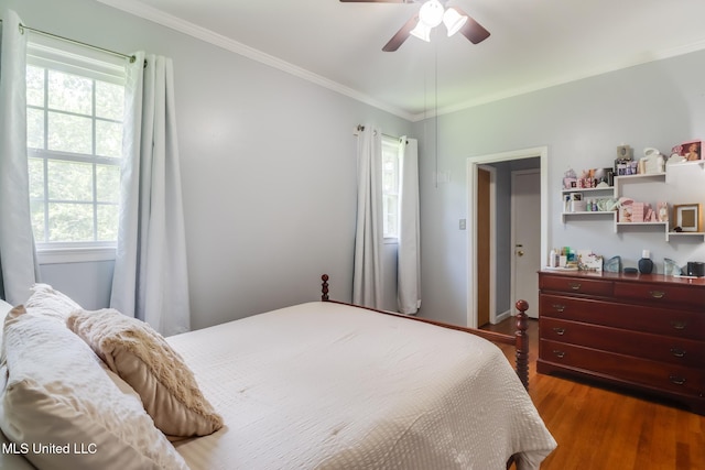 221 S Third St, Wiggins, MS 39577 - bedroom with multiple windows, wood finished floors, crown molding, and ceiling fan