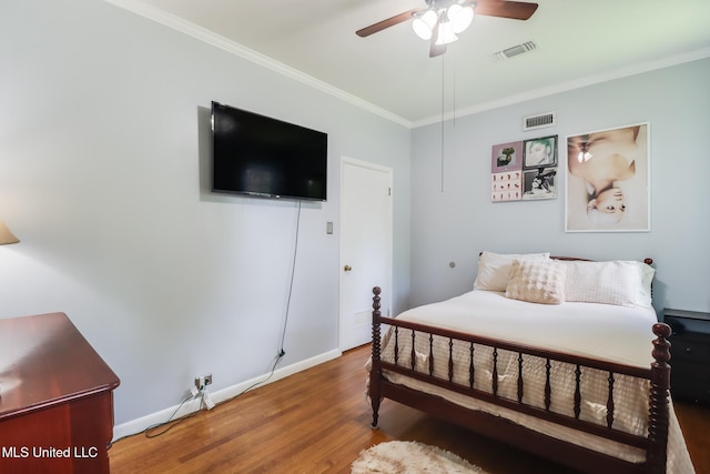221 S Third St, Wiggins, MS 39577 - bedroom with crown molding, wood finished floors, and ceiling fan