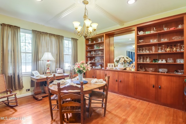 221 S Third St, Wiggins, MS 39577 - dining area with a chandelier, light wood-style floors, and beam ceiling