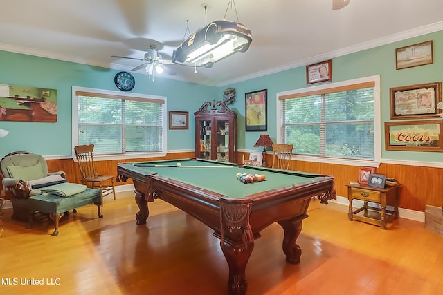 rec room featuring ornamental molding, wainscoting, wood finished floors, pool table, and a ceiling fan