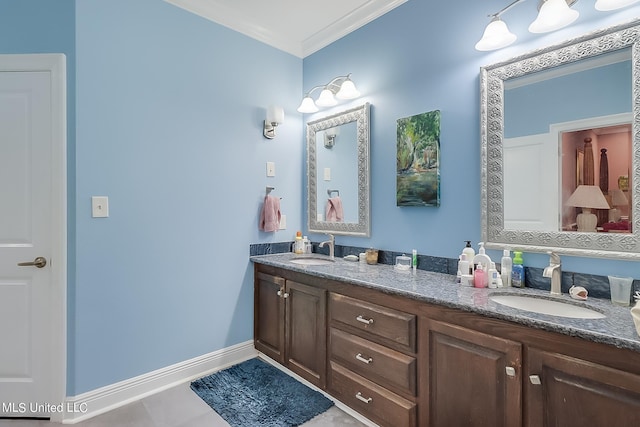 bathroom with double vanity, a sink, baseboards, and ornamental molding