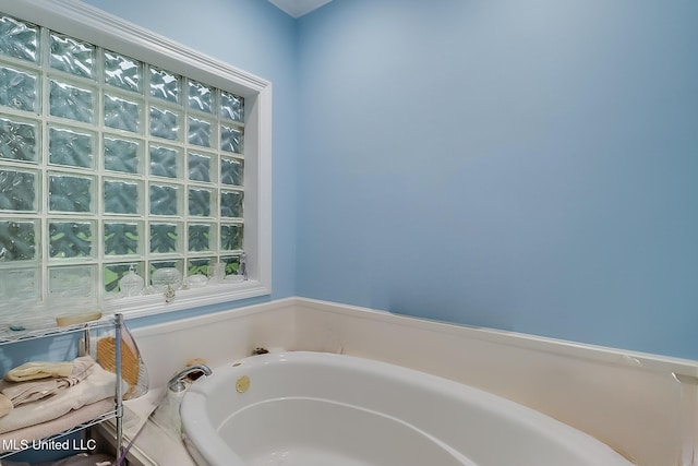 bathroom with a garden tub