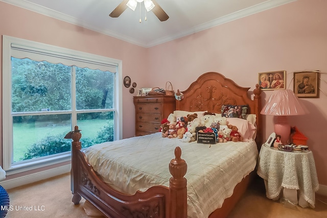 carpeted bedroom featuring crown molding and a ceiling fan