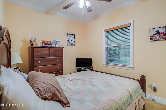 carpeted bedroom with baseboards, ornamental molding, and ceiling fan