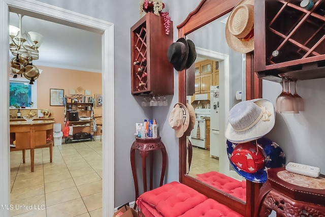 interior details featuring crown molding and white appliances
